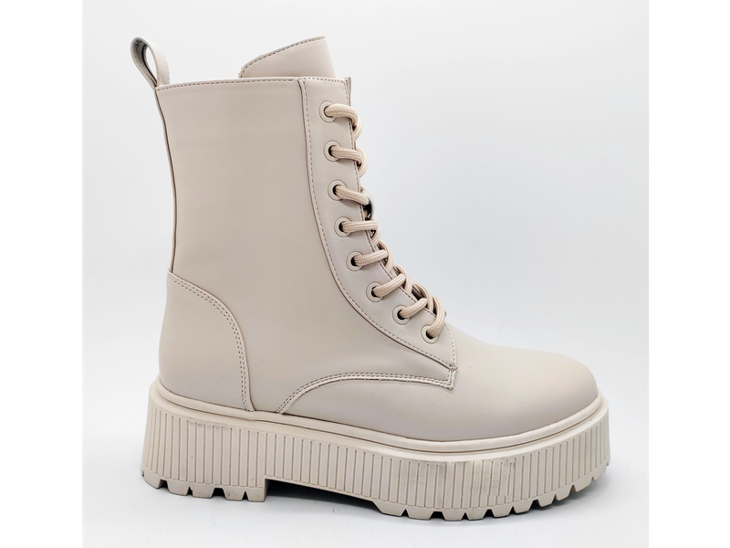 Botas femininas bege com design vanguardista e sola alta